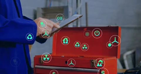 Tech tapping tablet at bench making energy icons over red toolbox touching Stock Footage 332288854