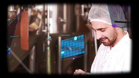 Tech tapping tablet near processing tanks, overlaying HUD on tablet, smiling Stock Footage 334185189