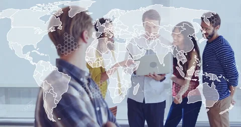 Tech team around laptop discussing data, world map evolving to network nodes Stock Footage 311098383