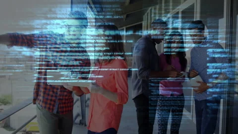 Tech team examining tablet showing code overlay on balcony gesturing toward city Stock Footage 310665951