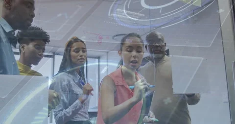 Tech team grabbing markers drawing flowchart on glass board while holographic 動画素材 315559498