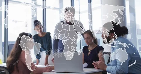 Tech team pointing at laptop in modern office, map graphic fading in data Stock Footage 318046292