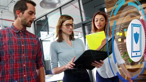 Tech team reviewing black folder and yellow binder camera panning phone shield Stock Footage 335317174