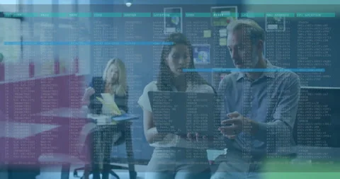 Tech team reviewing laptop while color lines appearing and animating code Stock Footage 310324328