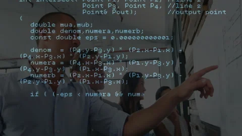 Tech team stepping and pointing note while marking note overlaying C++ code Stock Footage 312467173