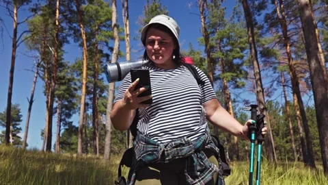 Tech in Tranquility Plus Size Woman Smartphone Relaxation on a Hiking Expedition Stock Footage 269844745