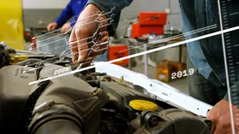Tech turning tool on auto engine, loosening clamp for service while timeline Stock Footage 332731564