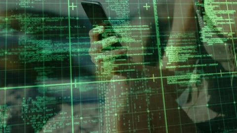 Tech user tightening smartphone grip activating green code grid and scanning Stock Footage 317799170
