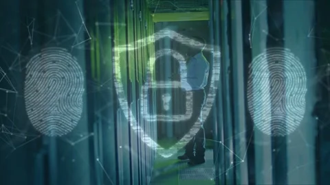Tech walking server aisle, pausing to inspect rack as security overlays Stock Footage 332625444