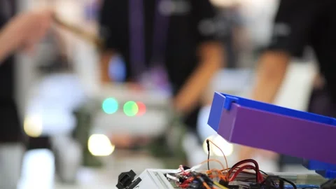 Tech workspace with circuitry and LED indicators in foreground 스톡 동영상 345703061