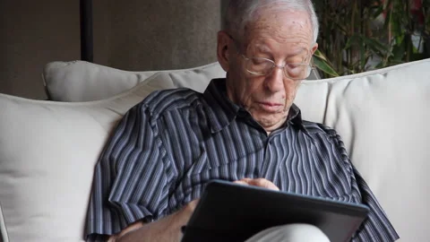 Techie Elderly Man on iPad Stock Footage 165076504