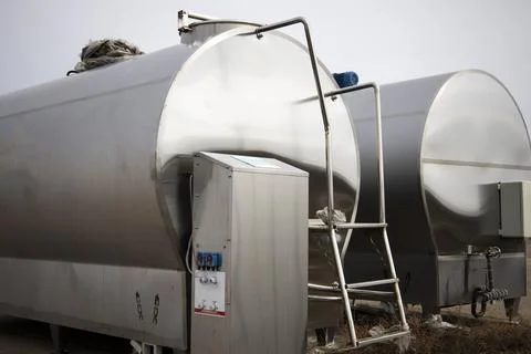 Technical barrels for milk cooling. Stock Photos