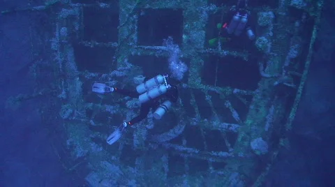 Technical diver exploring deep shipwreck - AIDA Stock Footage 841708