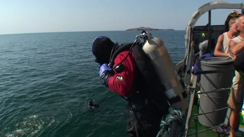 Technical diver jumps into the water from the ship. Stock Footage 165560284
