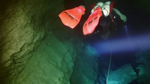 Technical diver in red flippers in the underwater cave of Budapest Stock Footage 142751434