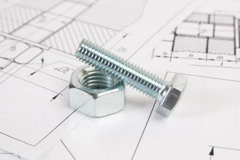 Technical drawings of bolt and nut. Engineering, technology and metalworking. Stock Photos