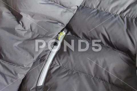 Technical duvet for mountain sport activities Stock Photos