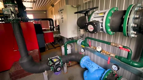Technical equipment of the mini-boiler room: pipes, valves, pressure gauges. Stock Footage 285515840