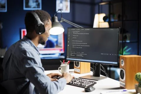 Technical expert works on html software code at home Stock Photos