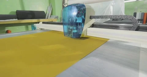 Technical Fabric Processing on CNC Plotter. Industrial CNC Cutter Processing Stock Footage 339287716