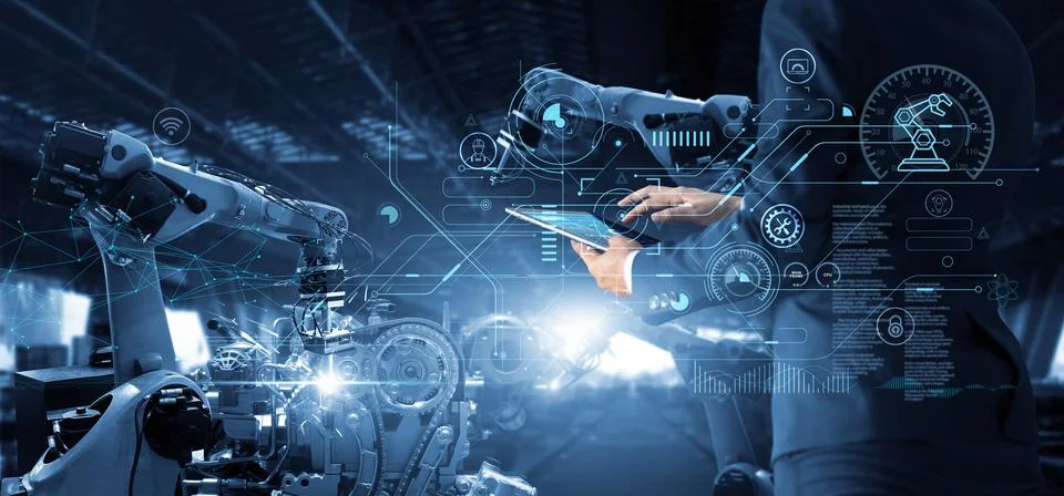 Technical Industrial Engineer Manager working and controlling robotics Fotos Stock