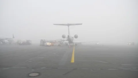 Technical inspection of airplanes during quarantine time in fog Stock Footage 129749369