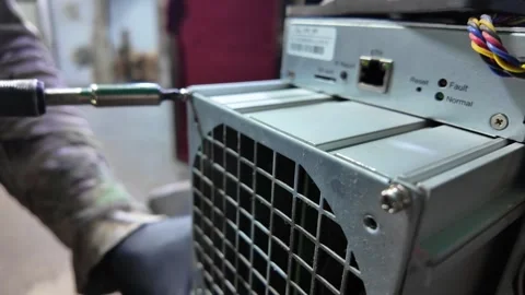 Technical Maintenance of an Antminer ASIC Cryptocurrency Miner Hardware Stock Footage 326577820