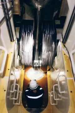 Technical maintenance: Ship mechanic working inside a giant diesel engine. Stock Photos