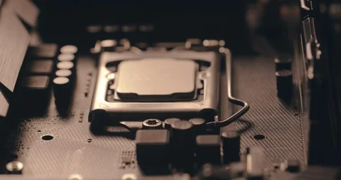 The technical man removes and inserts the chip processor into the Asus Stock Footage 125838083