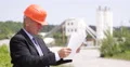 Technical Manager Examining Blueprint Check Project Concrete Preparation Factory 4k or 4k+ Resolution