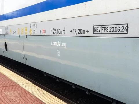 Technical markings on a passenger train carriage side panel showing maintenance Stock Photos