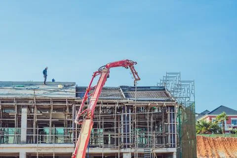 Technical modern telescopic self erection crane. Concrete multi-storey new house Stock Photos