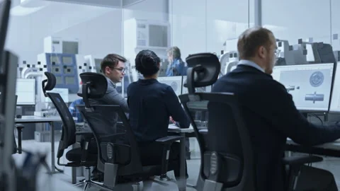 Technical Office Engineers work on Computer Video stock 321005248