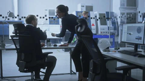 Technical Office Engineers work on Computer Video stock 321005284