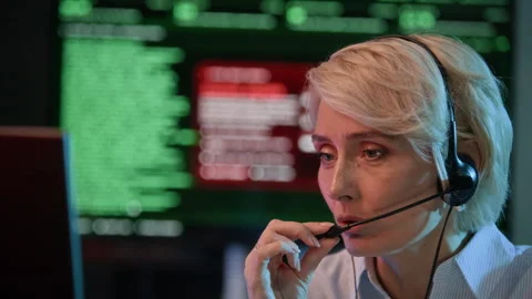 Technical Operator Detecting Cyberattack and Reporting via Headset in Office 스톡 동영상 334933851