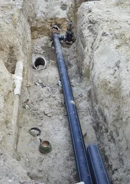 Technical pit with a pipe, repair of communications. replacement of water pipes Foto stock