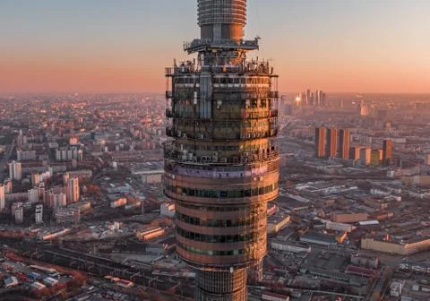 Technical premises of the television tower on the background of the sunset city Stock Photos