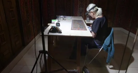 A technical researcher works on the restoration Stock Footage 242325082