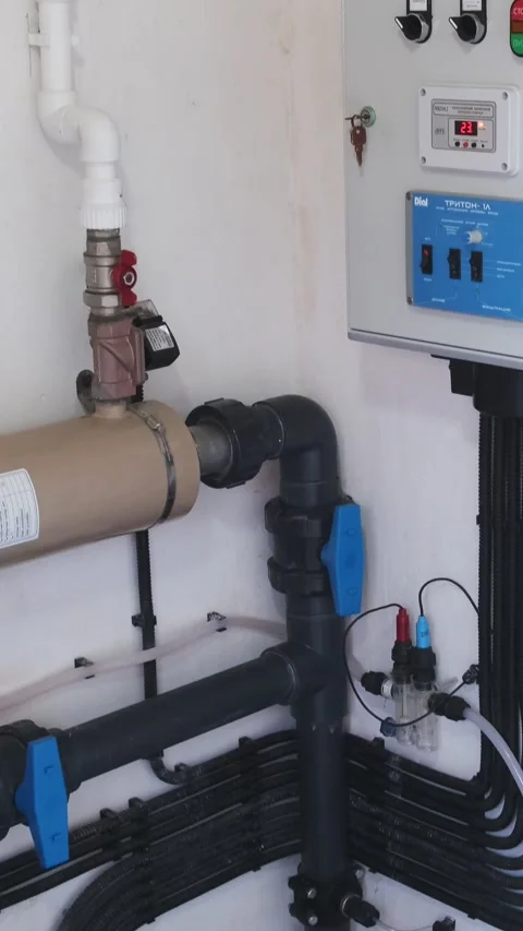 Technical room with pool control system: pump, automation panel, sensors, valves Stock Footage 312019058