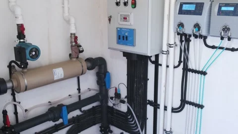 Technical room with pool control system: pump, automation panel, sensors, valves Stock Footage 312019060