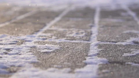 Technical salt reagent is sprinkled on ice in winter close up ,slow mo Stock Footage 100877153