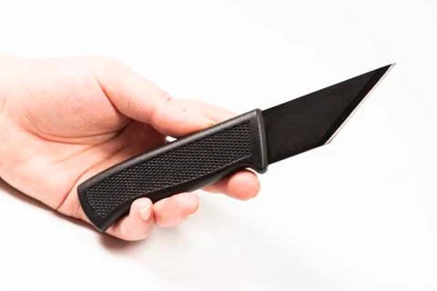 Technical shoemaker knife on the hand. White background Stock Photos