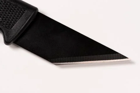 Technical shoemaker knife on the hand. White background Foto stock