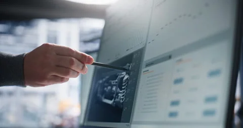 Technical Specialist Analyzing Robotic System Architecture on Interactive Stock Footage 344385928