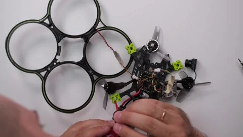 Technical Specialist apply thread lock to bolt drone fpv quadrocopter Stock Footage 244335317