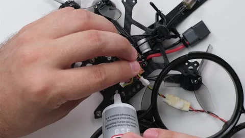 Technical Specialist assebmbly drone fpv quadrocopter Stock Footage 244335252