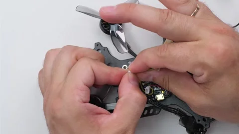 Technical Specialist assembly drone fpv quadrocopter after repair Stock Footage 244334774