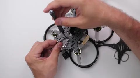 Technical Specialist assembly drone fpv quadrocopter Stock Footage 244335918