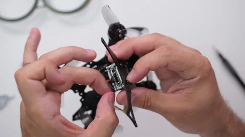 Technical specialist assembly fpv drone screw video transmitter air unit Stock Footage 244335970