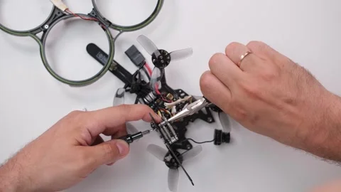 Technical specialist assembly fpv drone screw video transmitter air unit Stock Footage 244336111